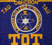 Large cloth banner promoting Tau Omicron Tau.